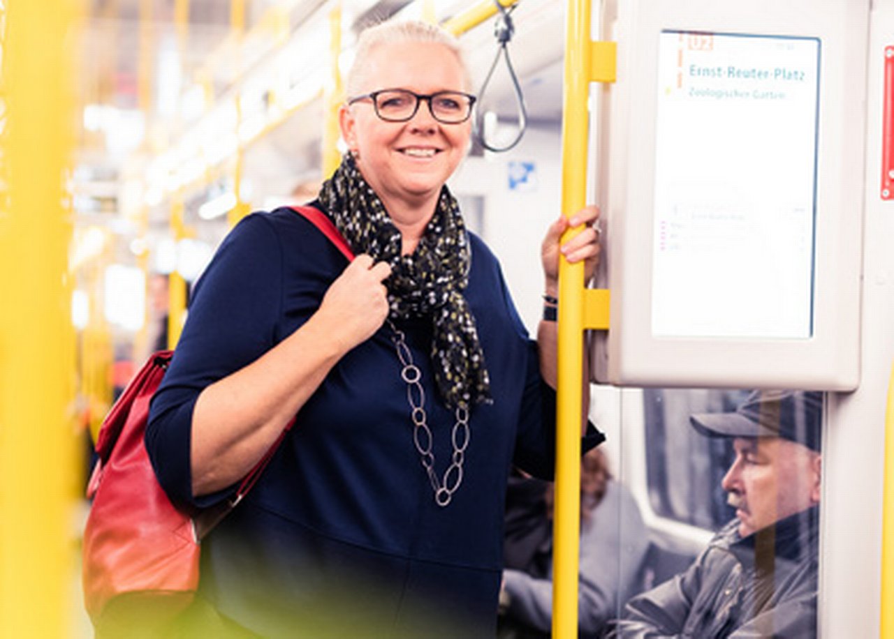 Angela with a backpack on the bus
